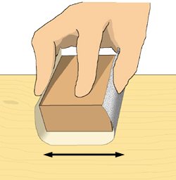 当て木にサンドペーパーを巻いて使っている様子